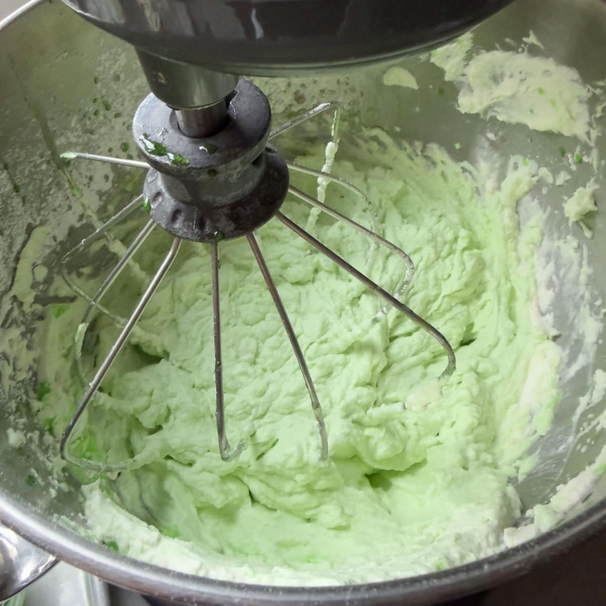 Beautiful green grasshopper pie filling in a mixer bowl, ready to use.