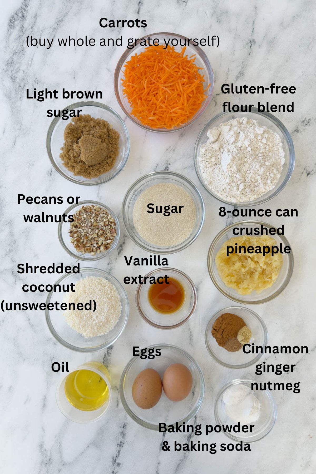 Ingredients for gluten free carrot cake in prep bowls on the counter.