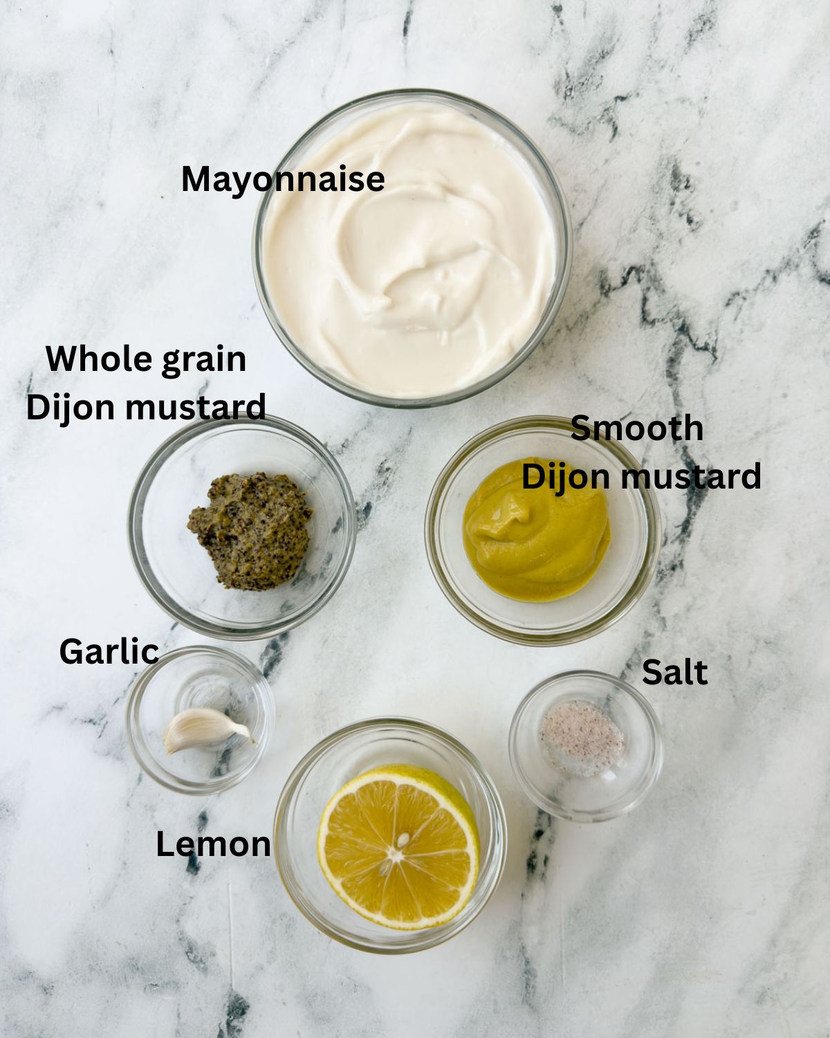 Prep bowls with ingredients to make mayo mustard sauce.