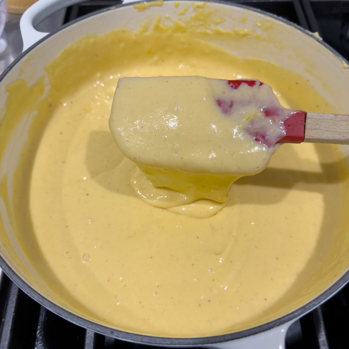 A finished cheese sauce for gluten-free mac and cheese ready to use.