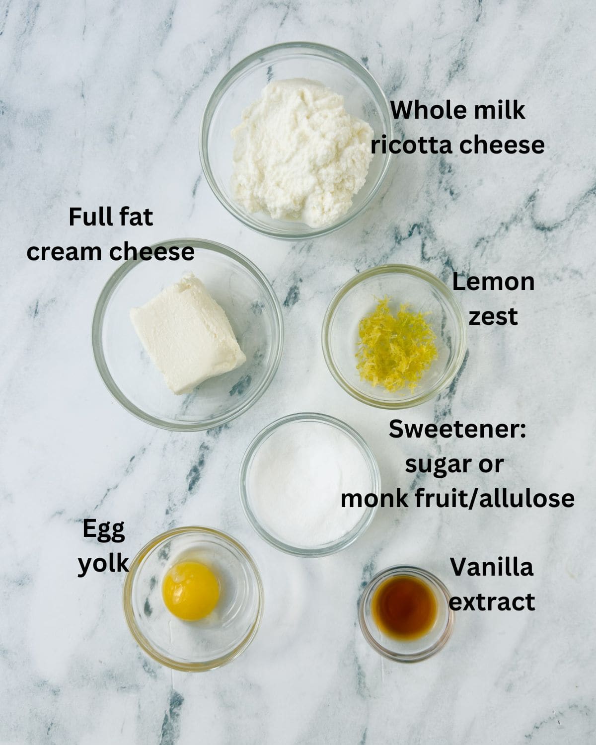 Cheese blintz filling ingredients in small bowls.