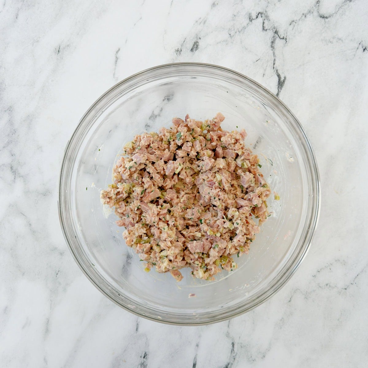 Finished ham salad in a glass bowl ready to serve.