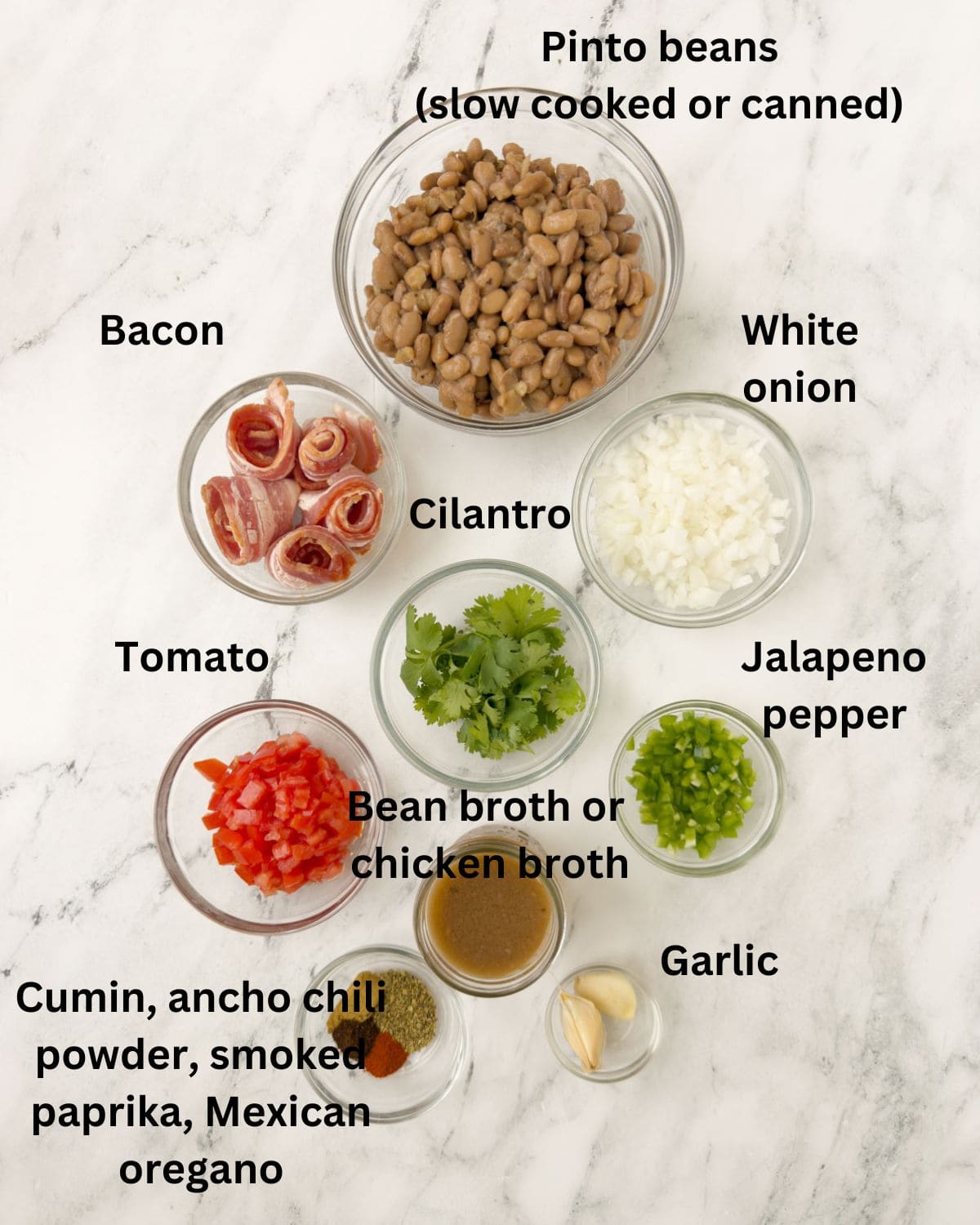 Ingredients for charro beans in prep bowls ready to go.