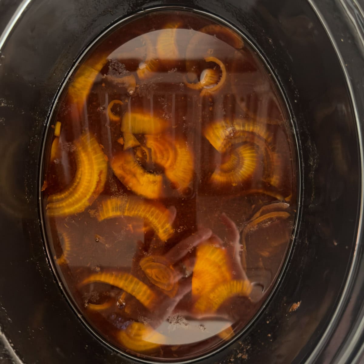 The leftover broth from slow cooker pork with onions.