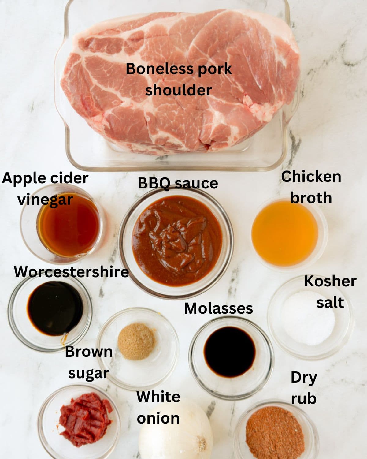 Ingredients for slow cooker BBQ pulled pork in prep bowls on the counter.