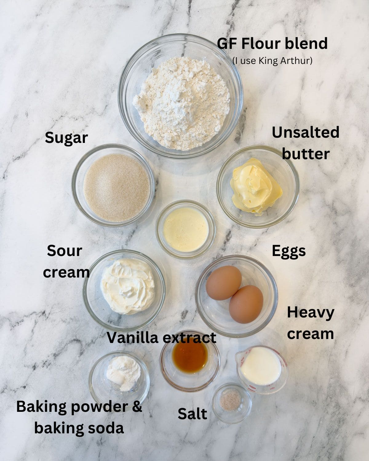 Dry ingredients in prep bowls for a strawberry shortcake cake.
