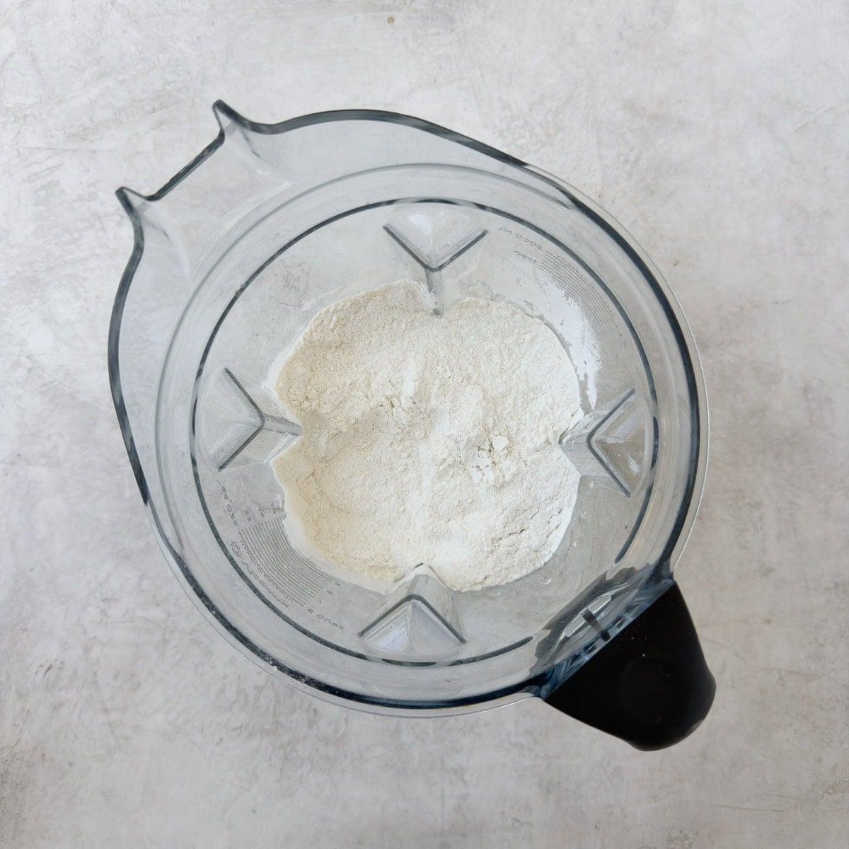Sugar in a blender being refined into superfine sugar.