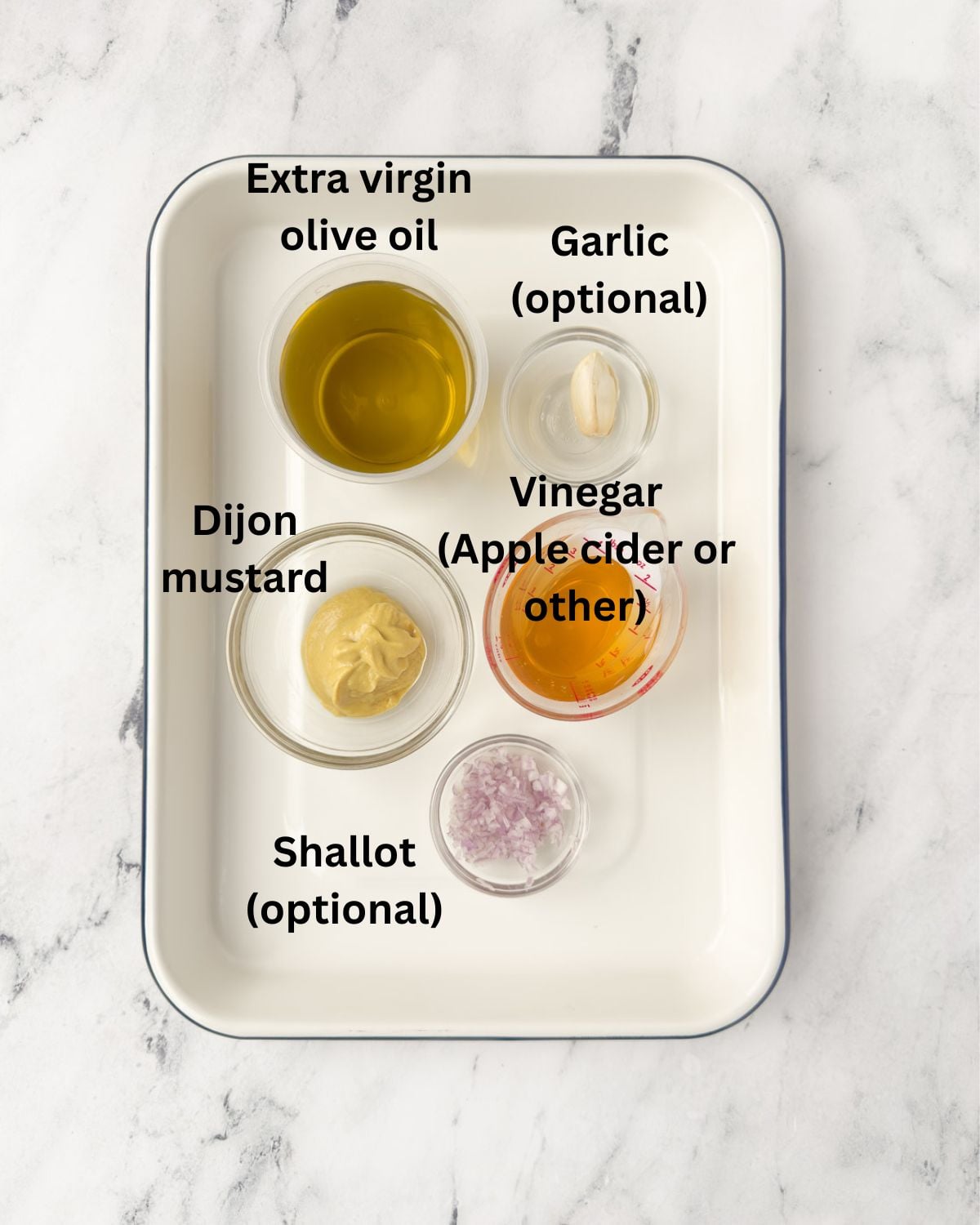 Olive oil, apple cider vinegar, dijon mustard, shallot, and garlic for Dijon vinaigrette.