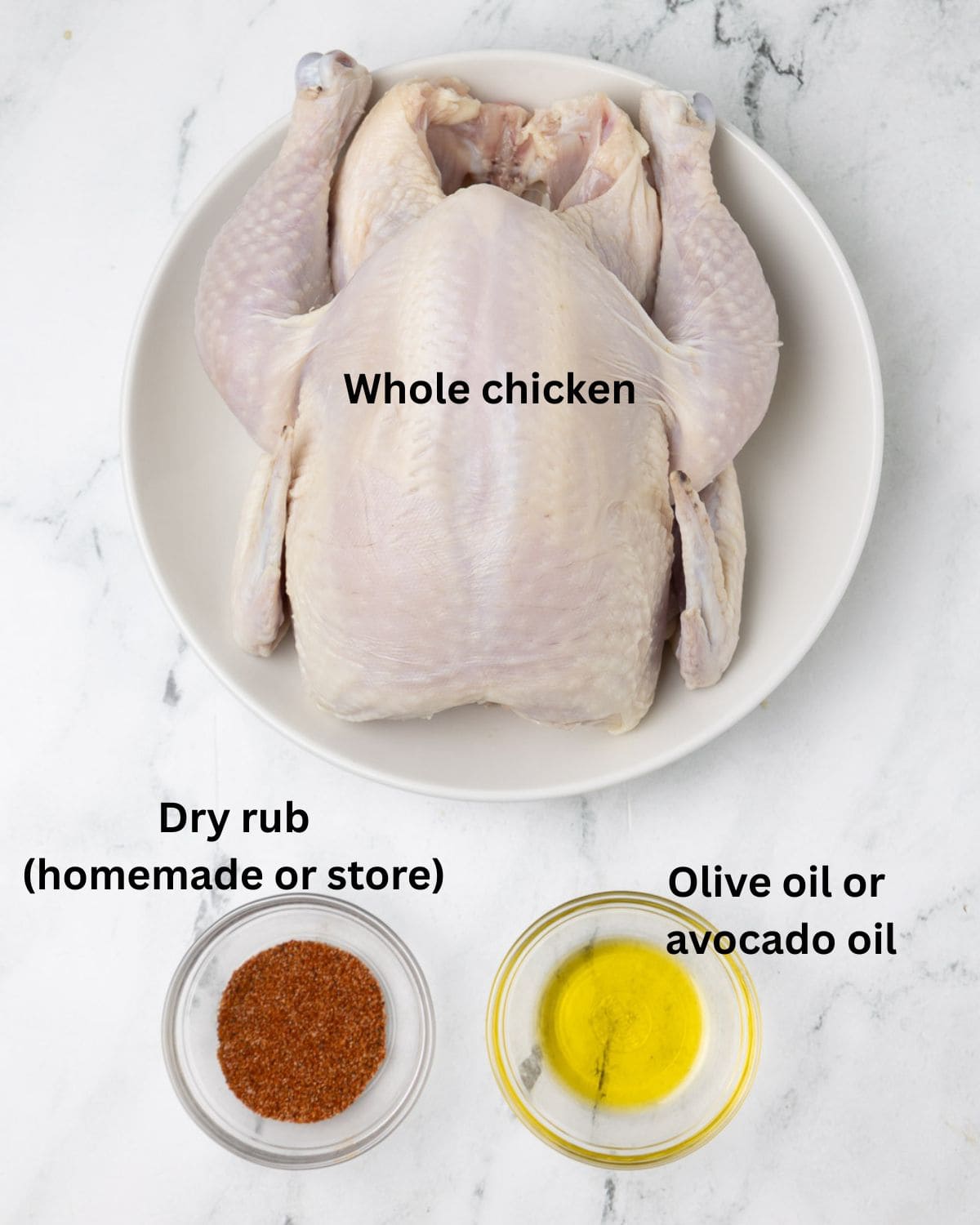A whole chicken along with dry rub blend and olive oil being prepped for a smoked chicken.