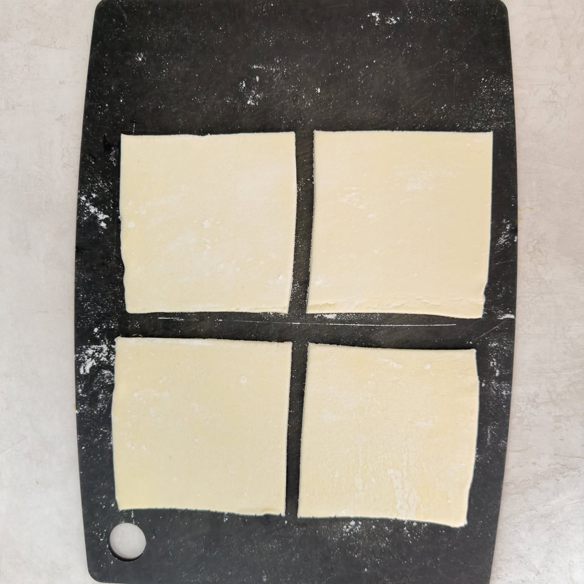 Puff pastry cut into 4 equal squares to make turnovers.