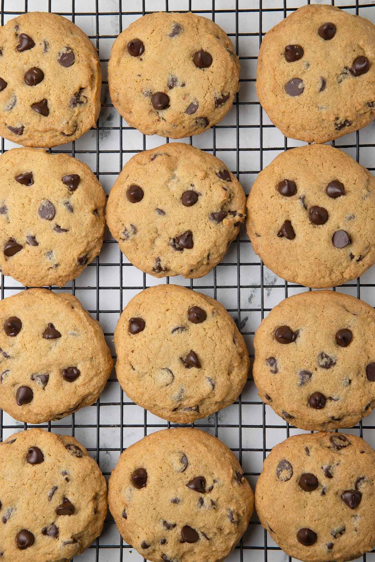 Gluten-free soft chocolate chip cookies cooling on a wire rack.