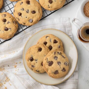 A plate of 3 gluten-free soft chocolate chip cookies and a cup of espresso.