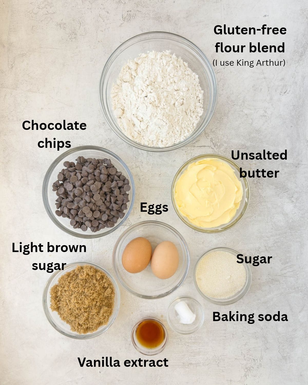 Ingredients for gluten-free soft chocolate chip cookies in prep bowls on the counter.
