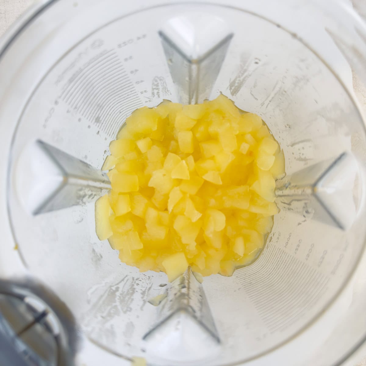 Cooked apples in a blender container.