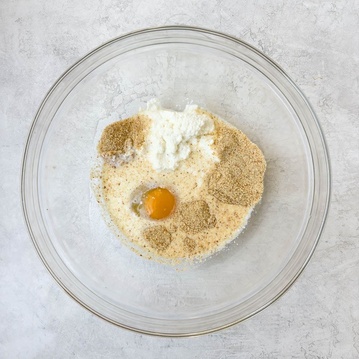 Egg, breadcrumbs, ricotta, and milk for the base of meatballs.