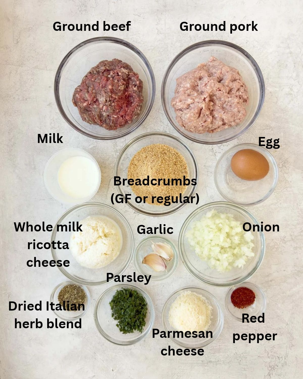 Ingredients for ricotta meatballs in prep bowls ready to go.